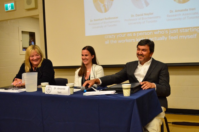 Photo of the three Let's #VoteScience panelists, laughing, sitting at table.